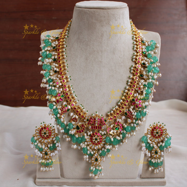 Exclusive grand Peacock and floral jadau long necklace with green beads and rice pearls