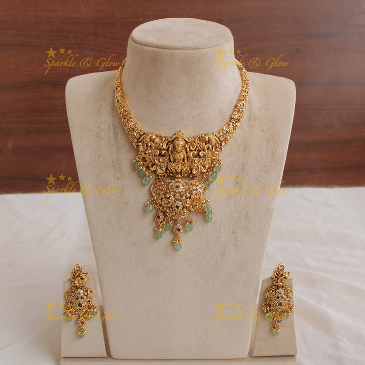 Exclusive Lakshmi peacock flower carved short necklace with multi colour stones and mint green beads