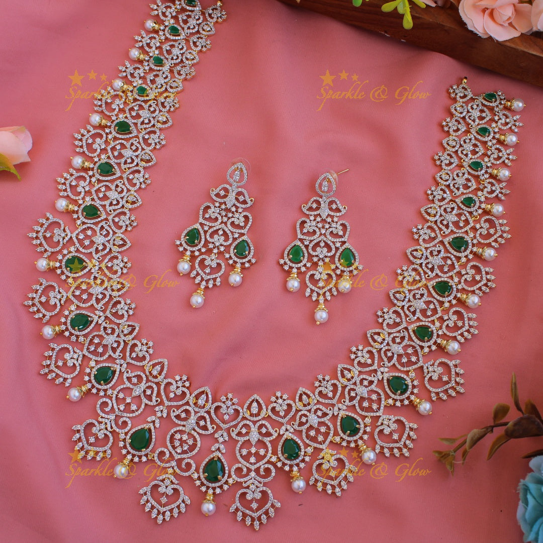 Grand intricate floral leaflet design American diamond long necklace with emerald and pearls - green