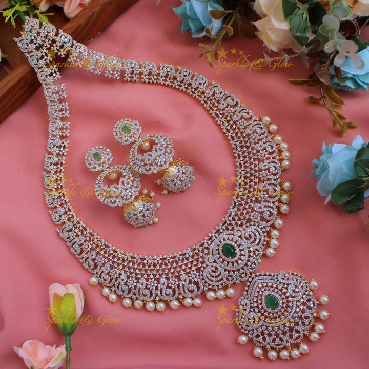 Exclusive Peacock floral design American diamond long necklace with ruby and pearl drops - pink