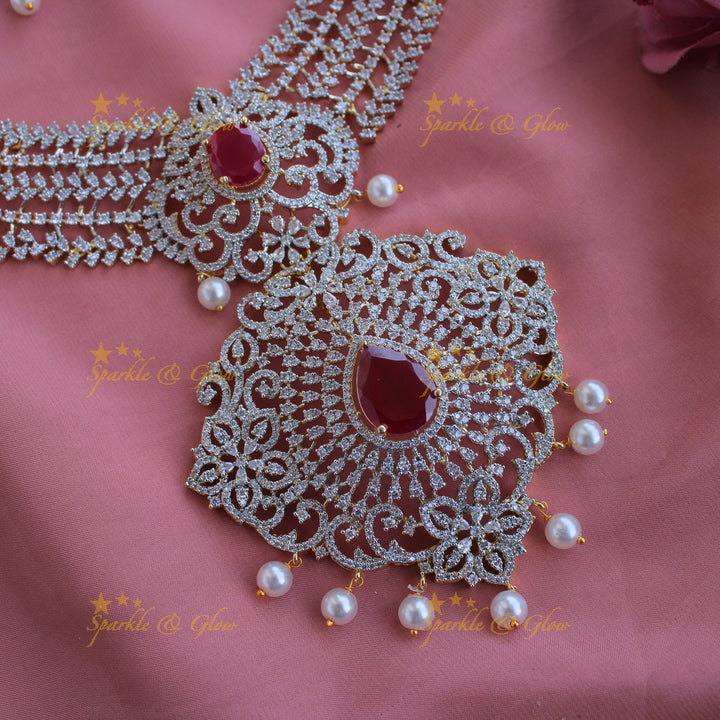 Sparkling Floral leaflet design American diamond long necklace with ruby and pearl drops - pink