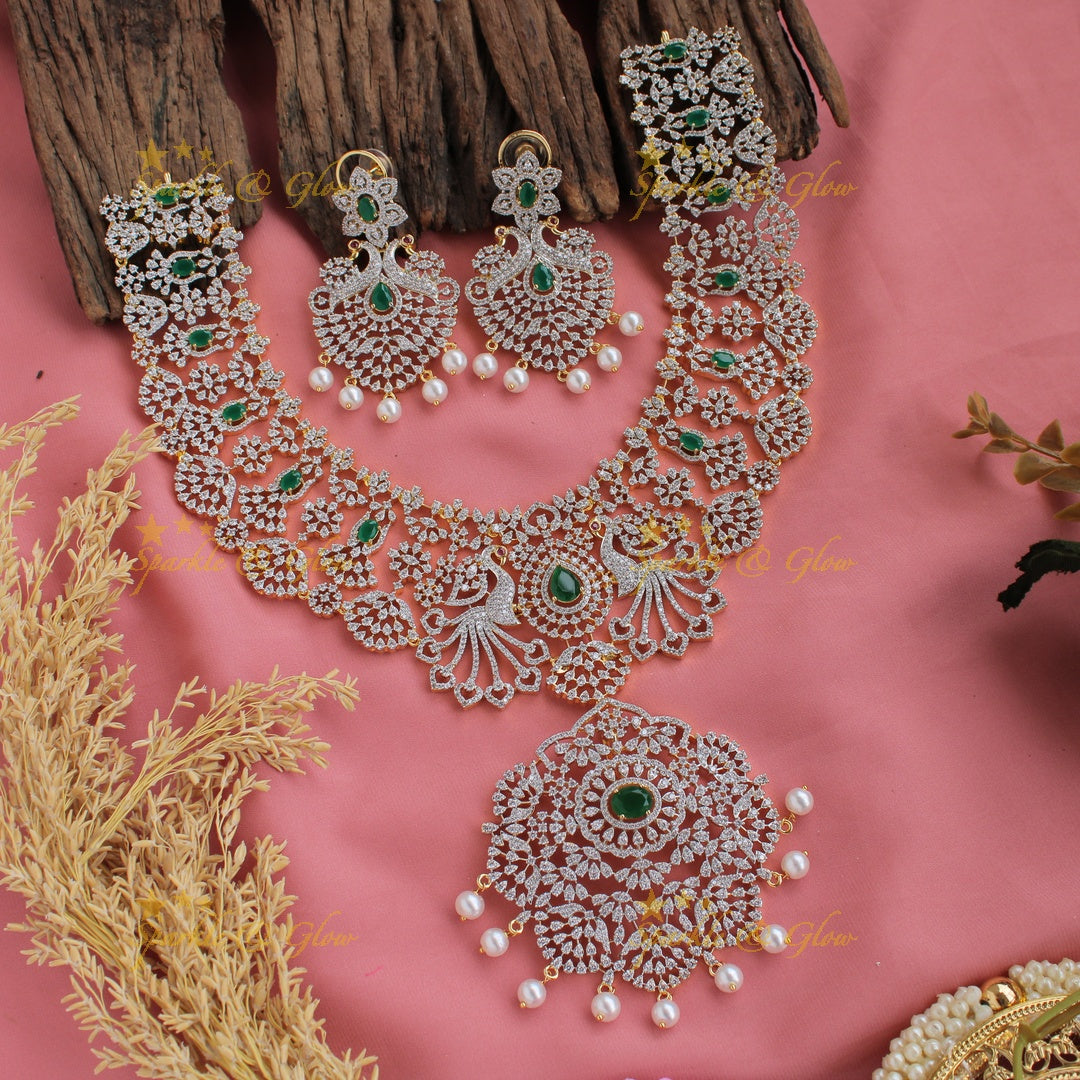 Grand peacock and floral design American diamond long necklace with pearls and emerald - green