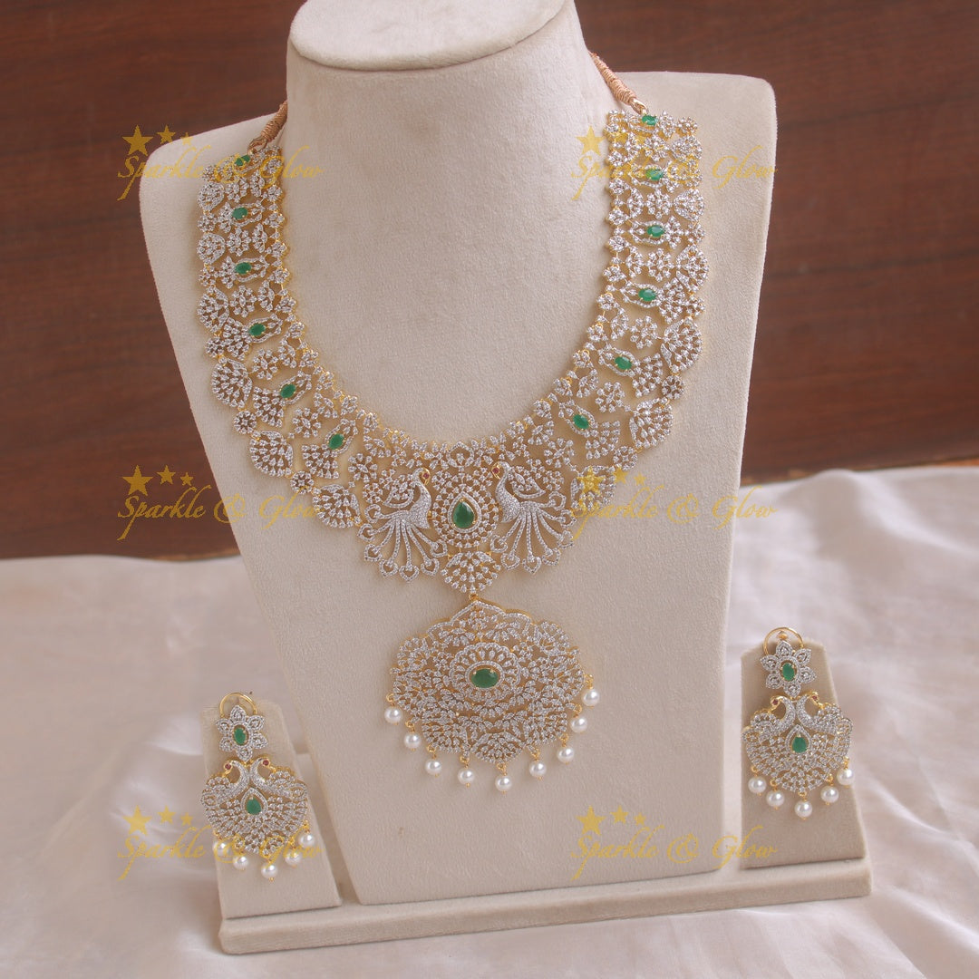 Grand peacock and floral design American diamond long necklace with pearls and emerald - green