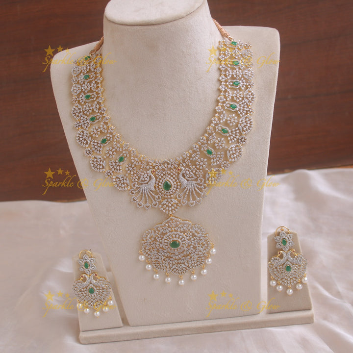 Grand peacock and floral design American diamond long necklace with pearls and emerald - green