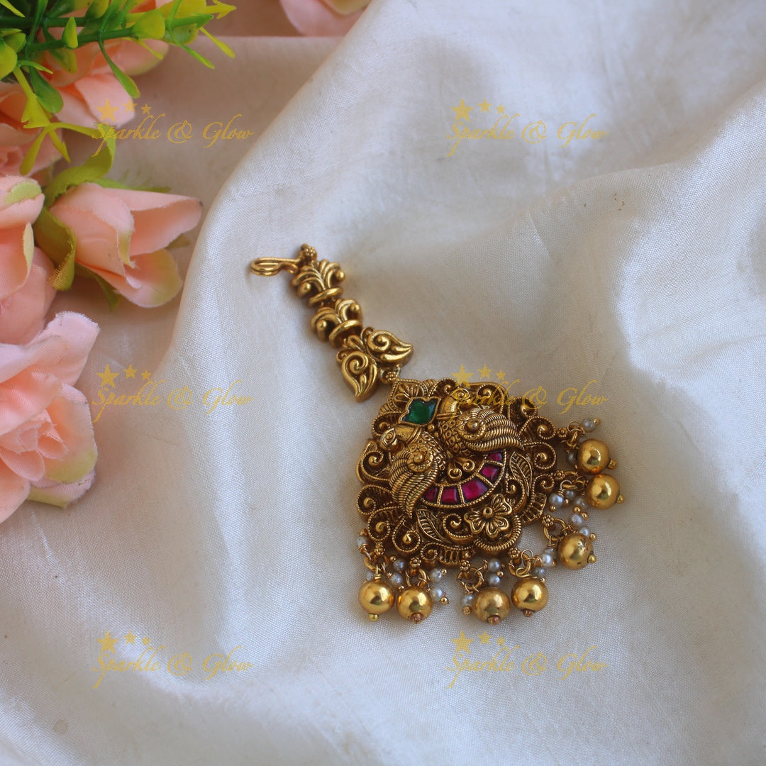 Statement Peacock carved jadau maang tikka with mint green beads