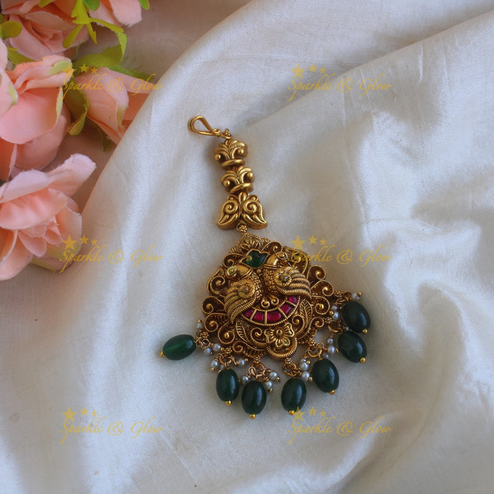 Statement Peacock carved jadau maang tikka with mint green beads