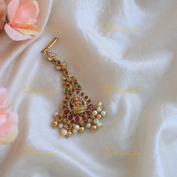 Stunning Lakshmi peacock maang tikka with CZ stones ruby emerald pearls and gold beads