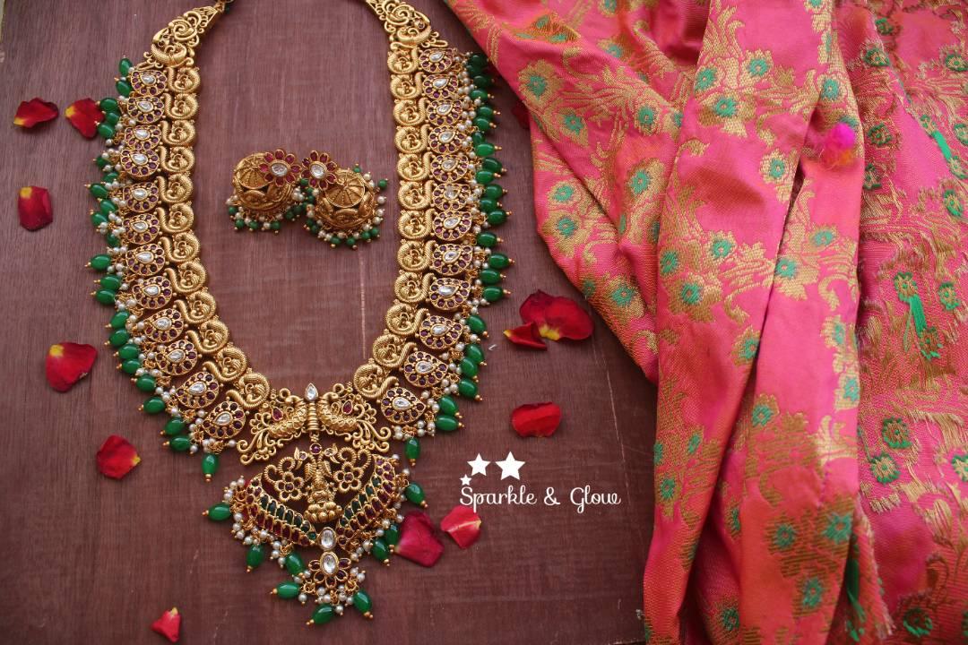 Gold alike polished peacock style grand nagas haram with green and gutta pusalu - Sparkle and Glow