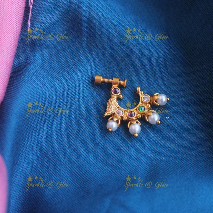 Gold ad Screw type peacock nosepin with Pearls - Sparkle and Glow