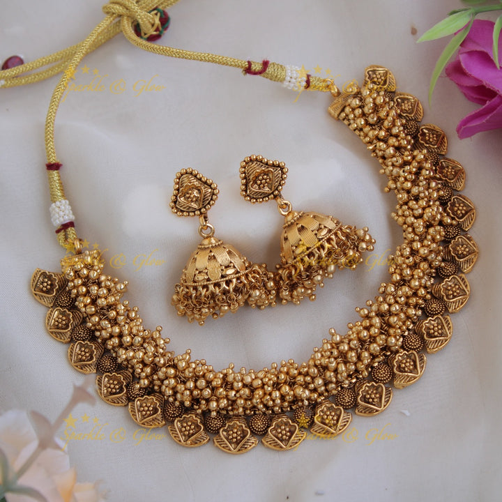 Beautiful intricate leaf design short necklace with gold beads cluster