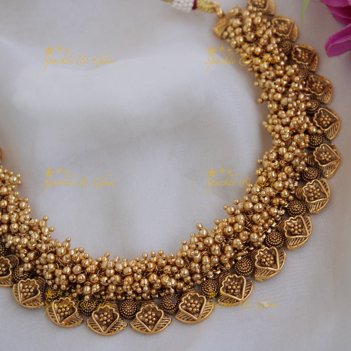 Beautiful intricate leaf design short necklace with gold beads cluster