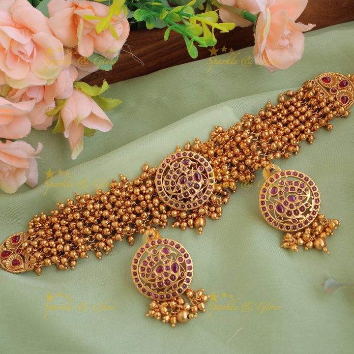 Elegant peacock choker with gold beads cluster
