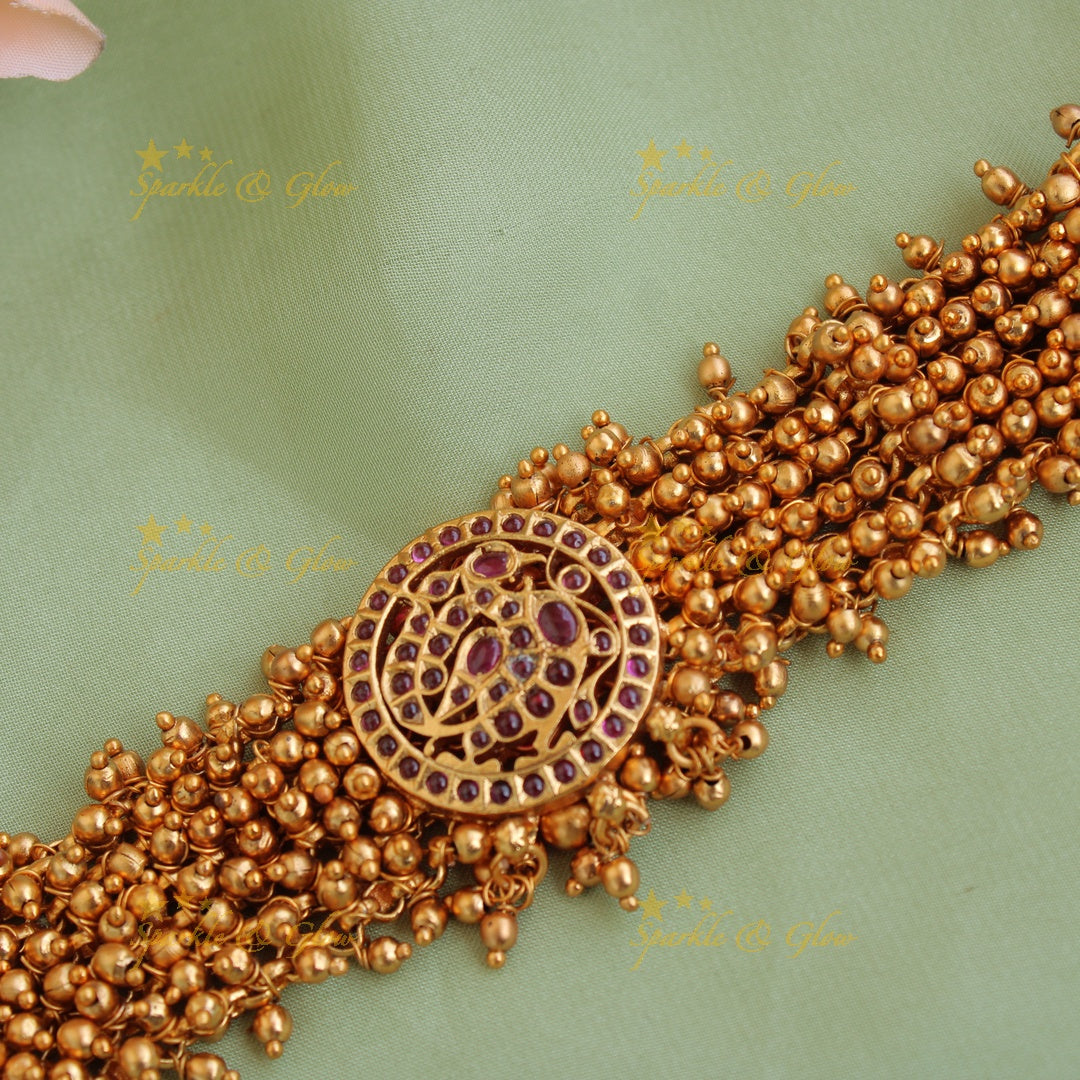 Elegant peacock choker with gold beads cluster