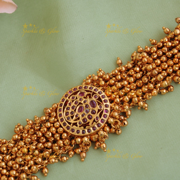 Elegant peacock choker with gold beads cluster