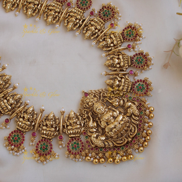 Grand intricate Lakshmi bottu long necklace with ruby emerald and gold beads