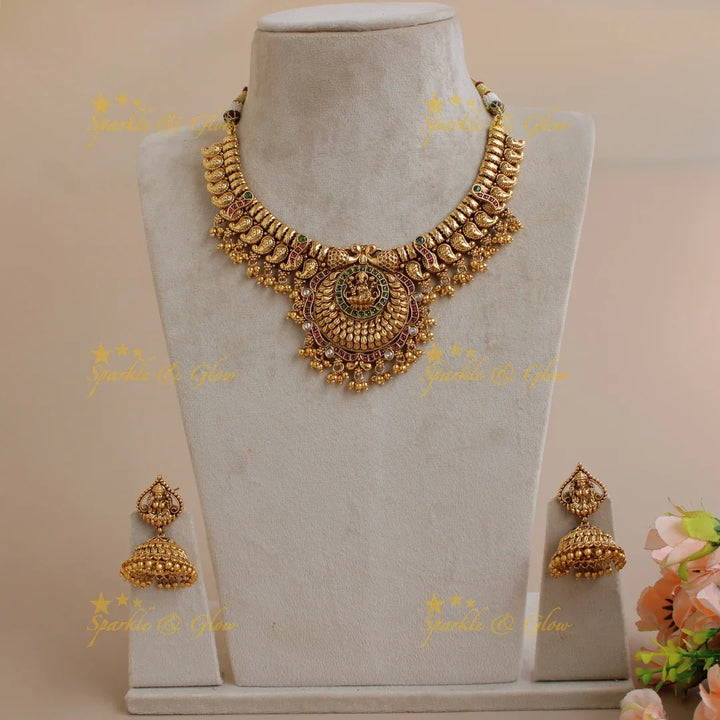 Statement Premium matt Lakshmi peacock mango short necklace with pearls and gold beads - Sparkle and Glow