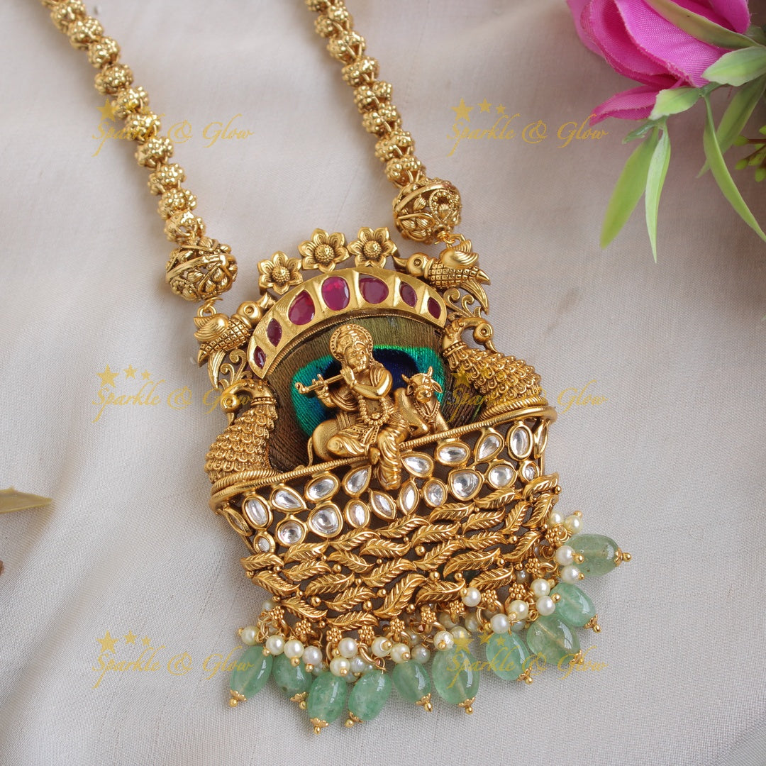 Gorgeous Krishna playing flute and peacock carved pendent with chain with stones and mint green beads