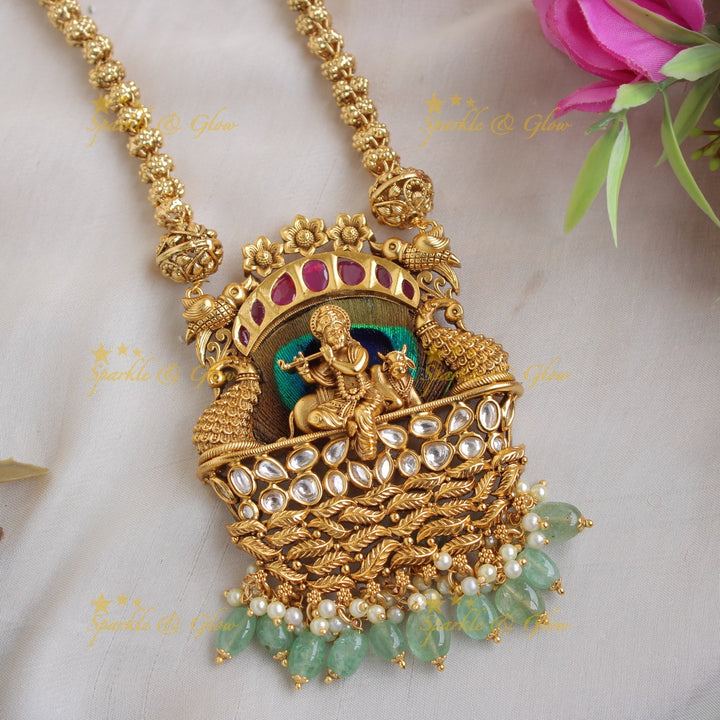 Gorgeous Krishna playing flute and peacock carved pendent with chain with stones and mint green beads