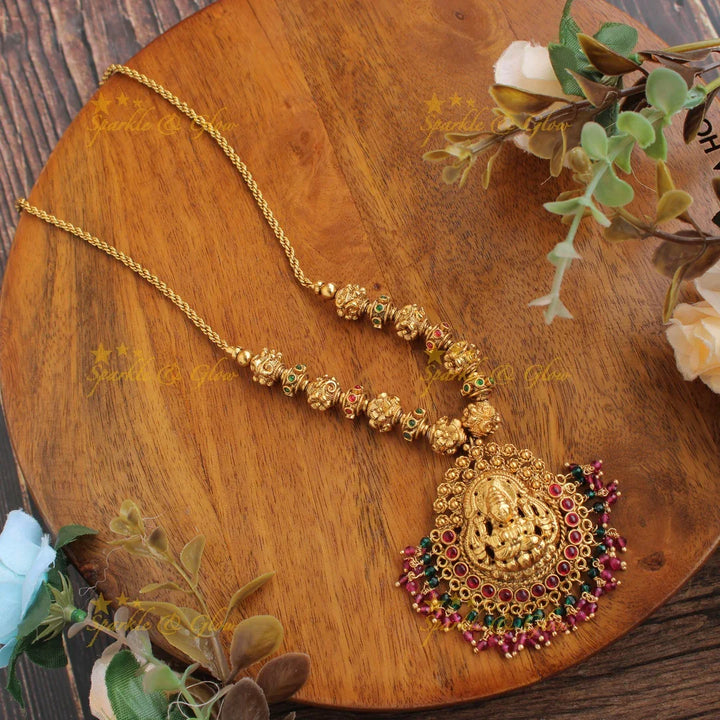 Gold alike Lakshmi carved Pendent with chain with multi color stones and pink green beads - Sparkle and Glow