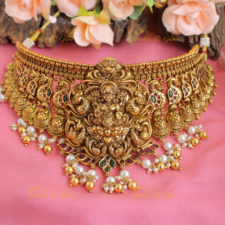 Grand intricate Lakshmi peacock carved kemp stone choker with pearls gold beads
