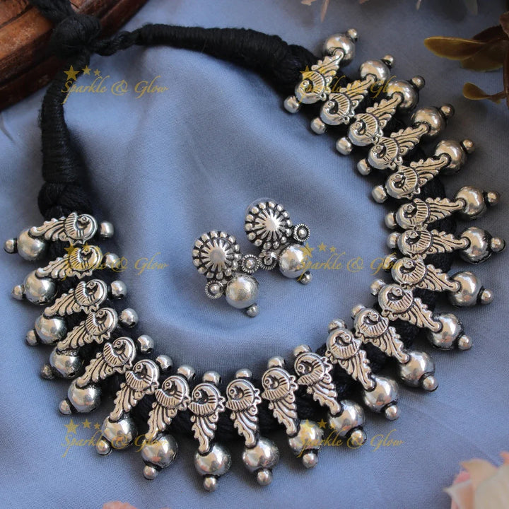 Statement Kohlapuri oxidised Peacock carved black thread silver short necklace with silver beads - Sparkle and Glow