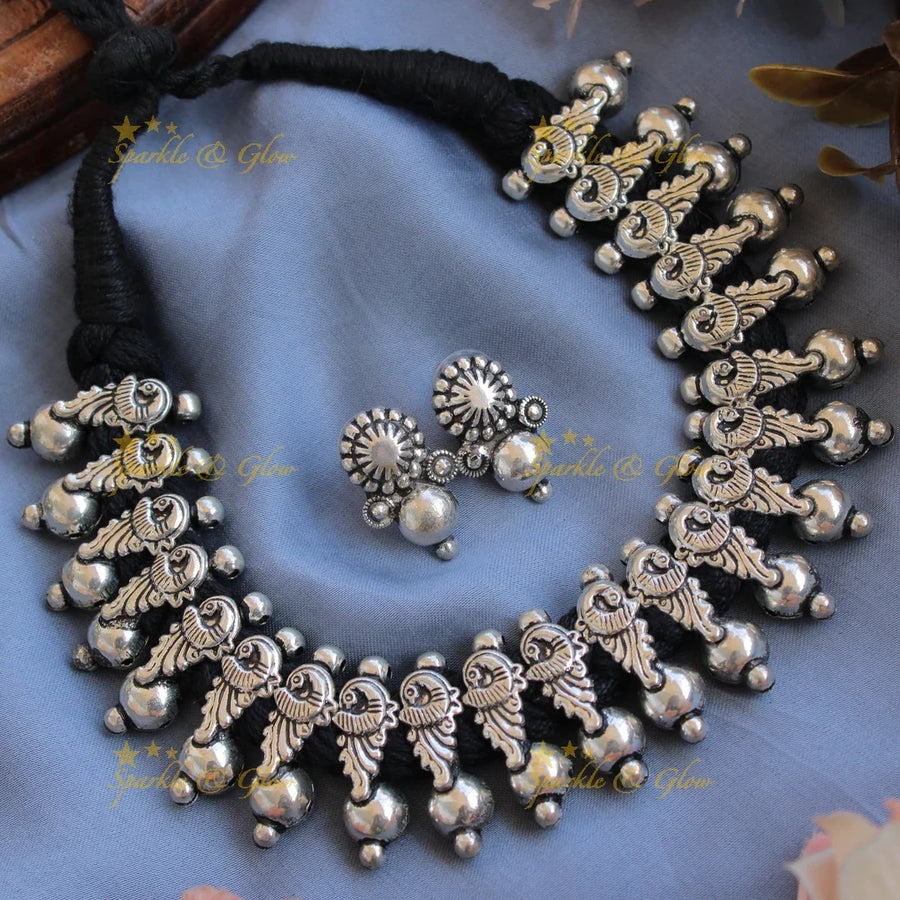 Statement Kohlapuri oxidised Peacock carved black thread silver short necklace with silver beads - Sparkle and Glow