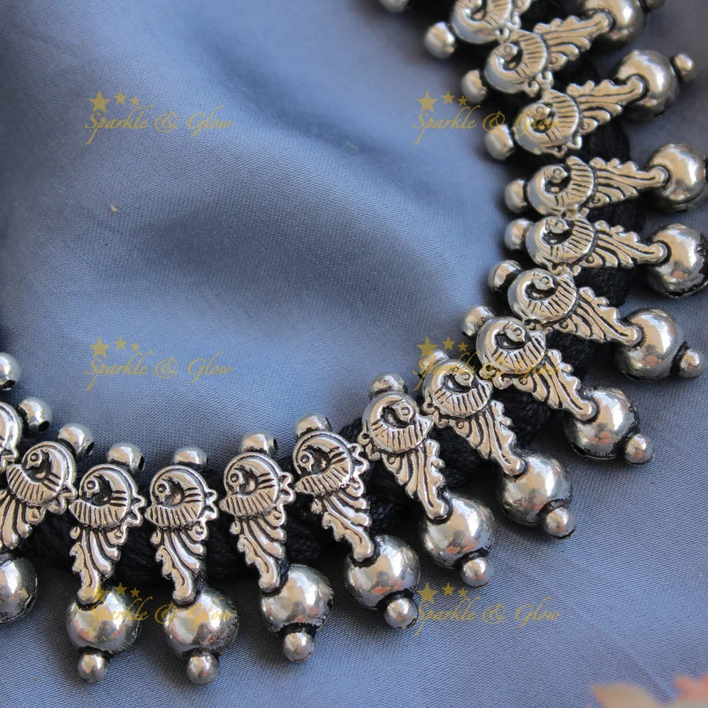 Statement Kohlapuri oxidised Peacock carved black thread silver short necklace with silver beads - Sparkle and Glow