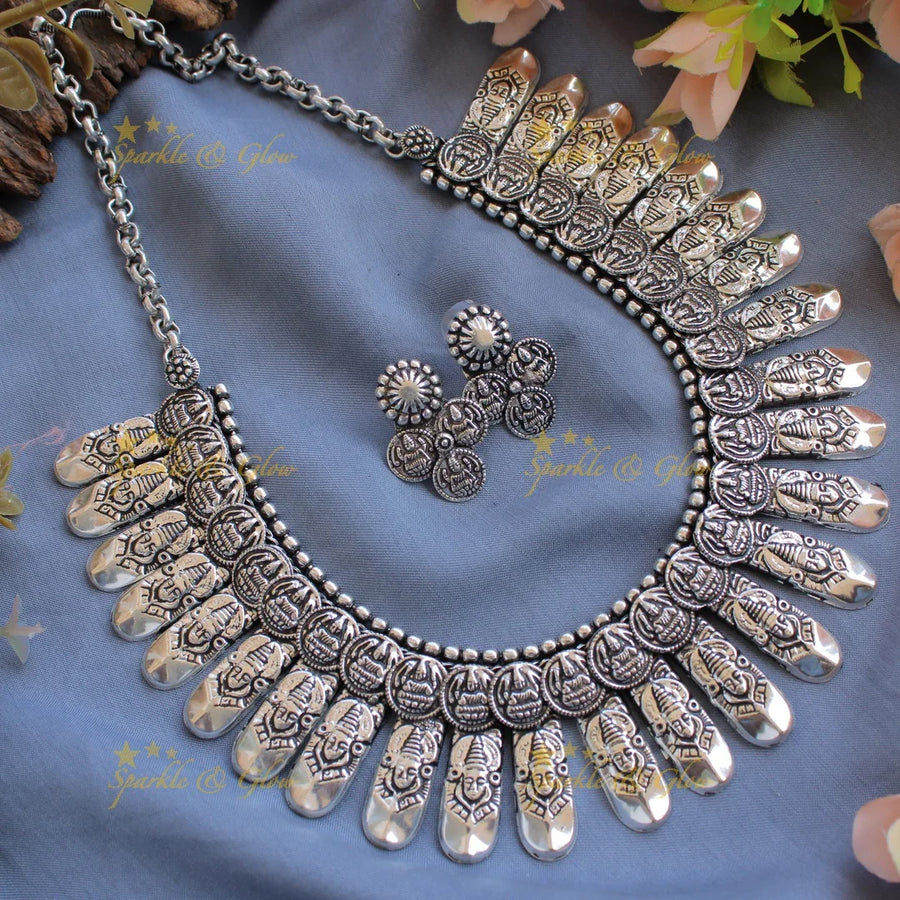 Grand intricate Kohlapuri oxidised Lakshmi coin and spike design silver short necklace - Sparkle and Glow