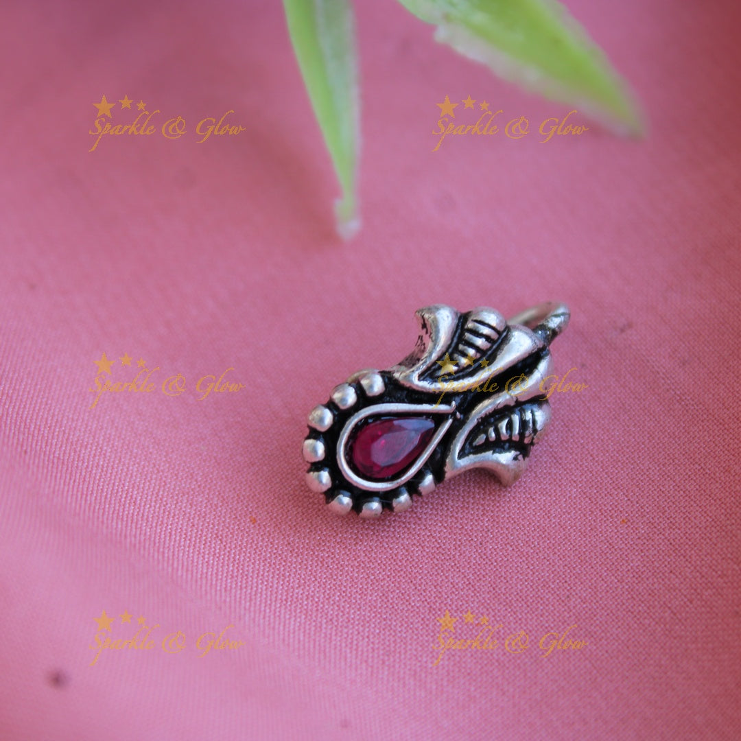 Beautiful design oxidised silver nose pin with ruby