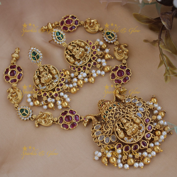 Elegant Lakshmi peacock carved floral short necklace with ruby emerald and pearls and gold beads