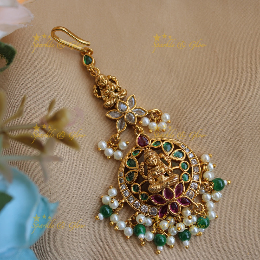 Elegant Lakshmi lotus moon design maang tikka with ruby emerald pearls and green beads