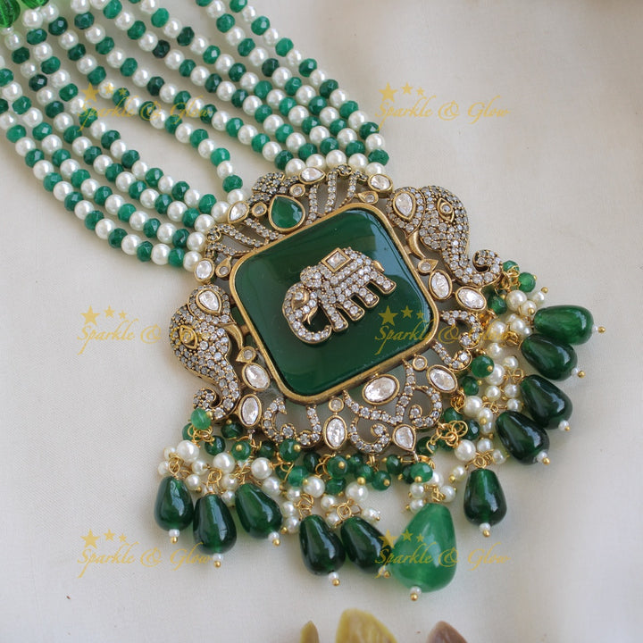 Gorgeous Elephant carved Victorian AD haram with emerald with multi layer pearl and green beads chain