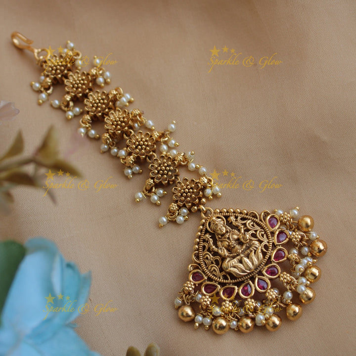 Stunning Lakshmi flower carved gutta pusalu maang tikka with ruby and gold beads