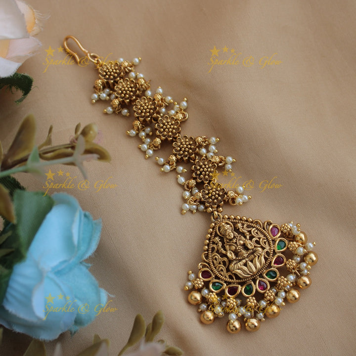 Stunning Lakshmi flower carved gutta pusalu maang tikka with ruby and gold beads