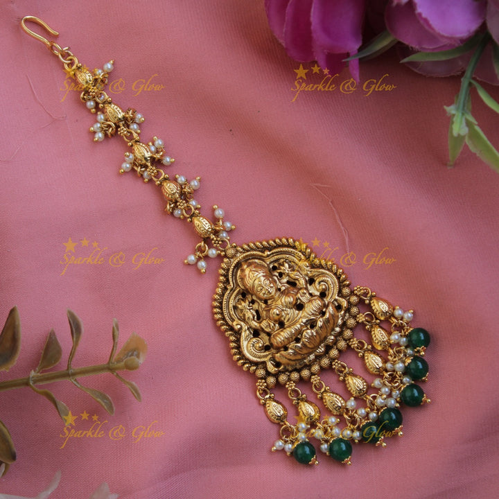 Gold alike Lakshmi carved gutta pusalu maang tikka with green beads