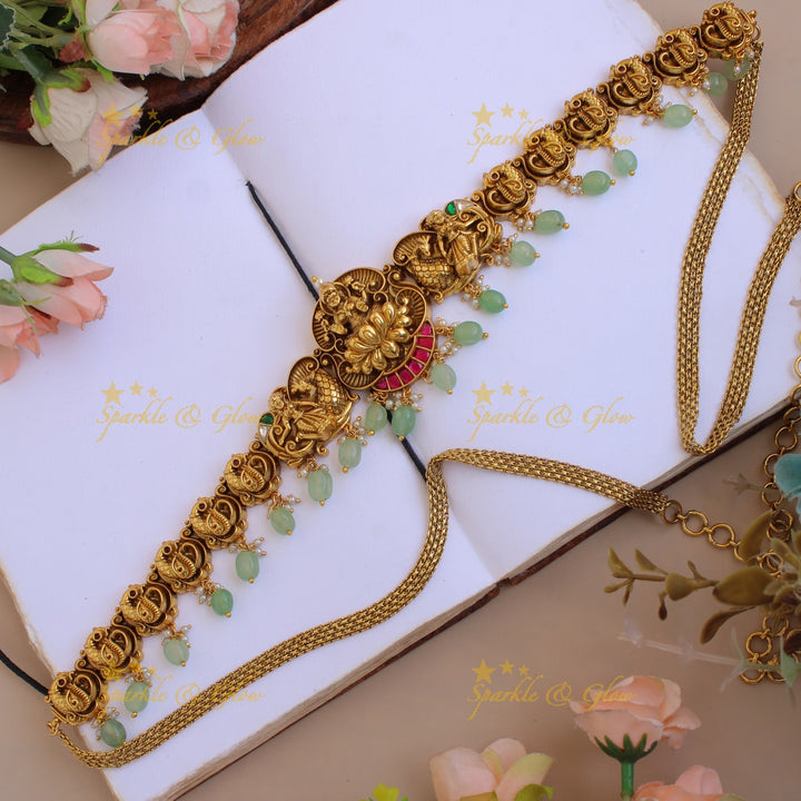 Elegant Lakshmi peacock carved jadau hipchain with pearls and mint green beads