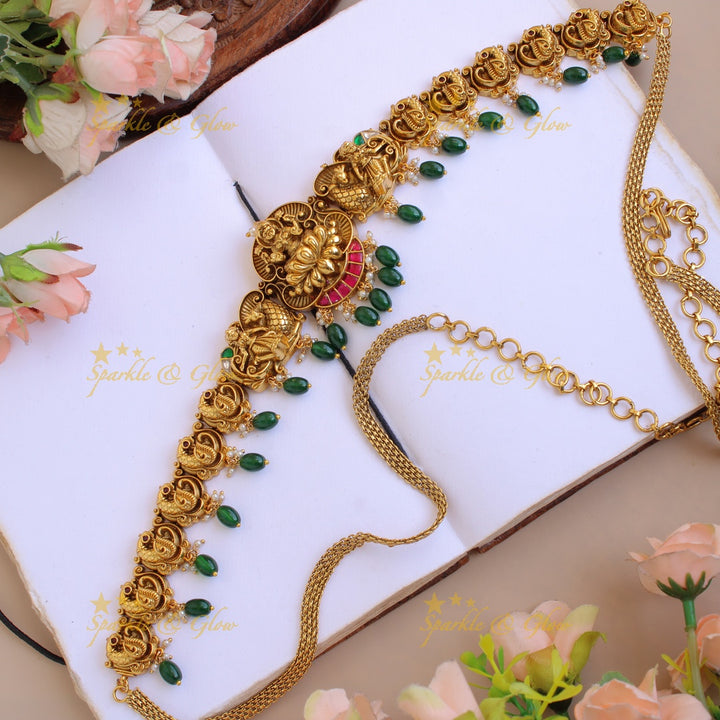 Elegant Lakshmi peacock carved jadau hipchain with pearls and mint green beads