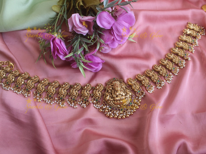 Grand Lakshmi peacock carved gutta pusalu hipchain with ruby and emerald