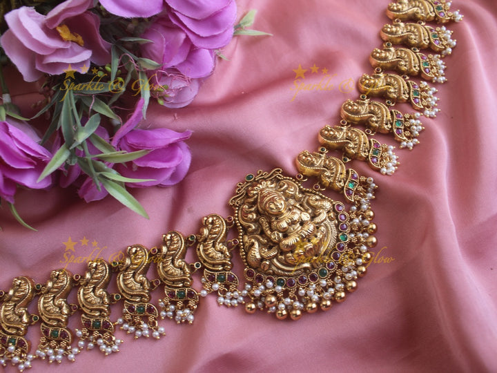 Grand Lakshmi peacock carved gutta pusalu hipchain with ruby and emerald