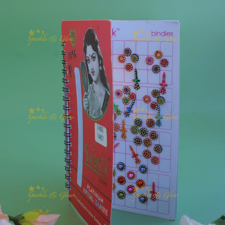 Swastik bridal stone bindi with different shape and size in spiral book in assorted colours