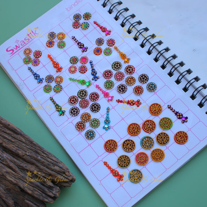 Swastik bridal stone bindi with different shape and size in spiral book in assorted colours