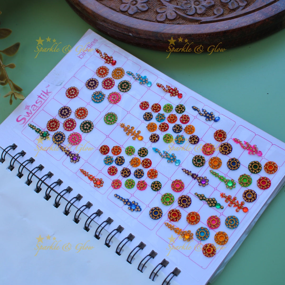Swastik bridal stone bindi with different shape and size in spiral book in assorted colours