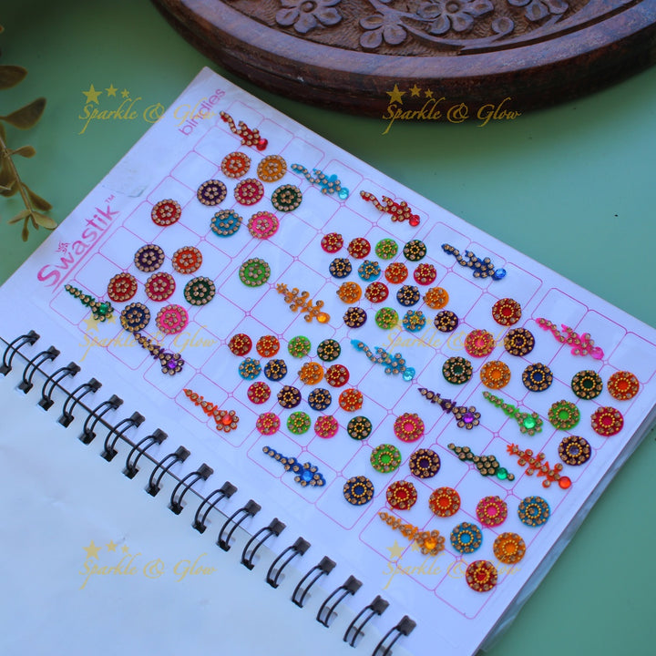 Swastik bridal stone bindi with different shape and size in spiral book in assorted colours