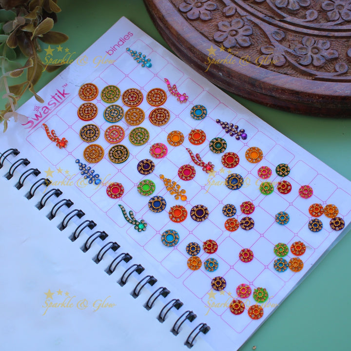 Swastik bridal stone bindi with different shape and size in spiral book in assorted colours