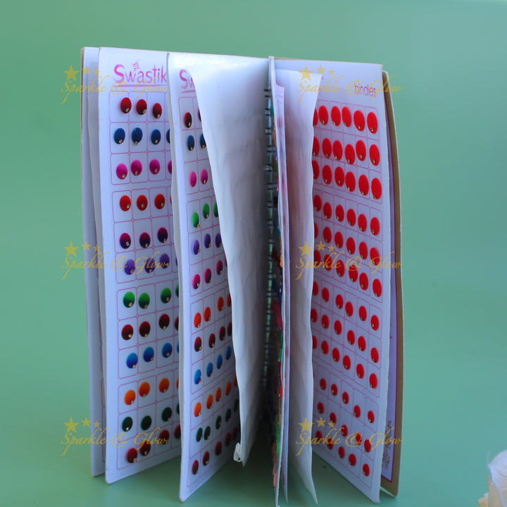 Swastik round shape single stone bindi with different size in spiral book in assorted colours