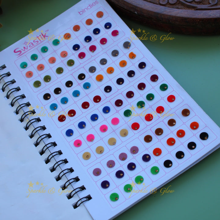 Swastik round shape single stone bindi with different size in spiral book in assorted colours
