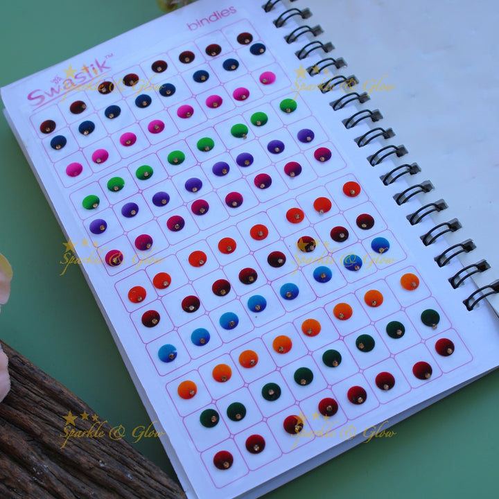 Swastik round shape single stone bindi with different size in spiral book in assorted colours