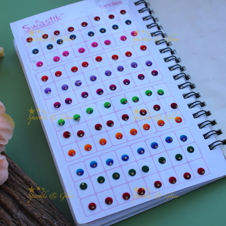 Swastik round shape single stone bindi with different size in spiral book in assorted colours