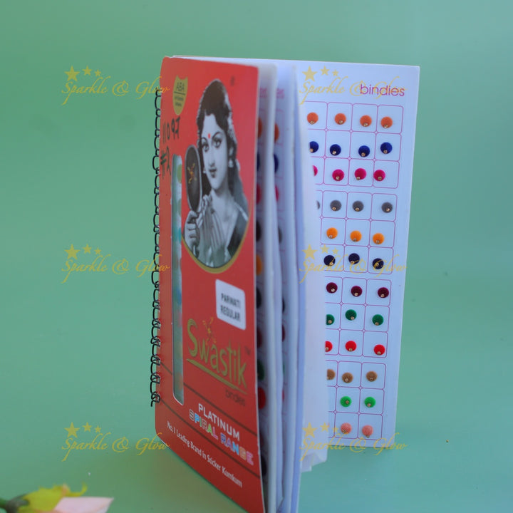 Swastik round shape single stone bindi with different size in spiral book in assorted colours