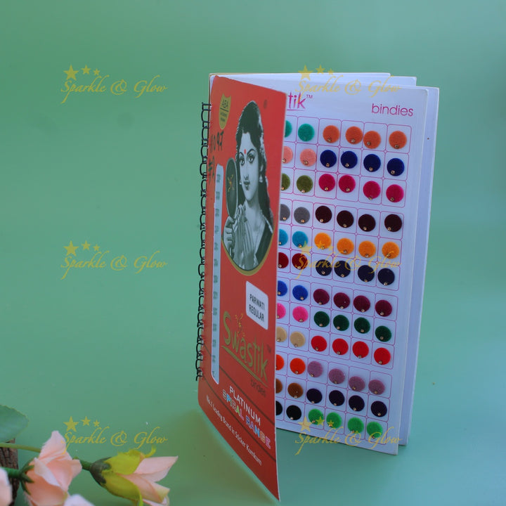 Swastik round shape single stone bindi with different size in spiral book in assorted colours